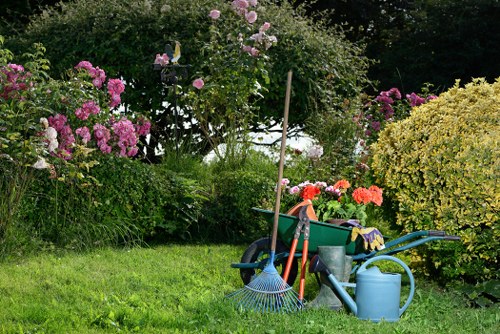 Professional gardeners using safety equipment during garden work