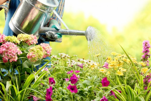 Professional gardener completing work with safety focus
